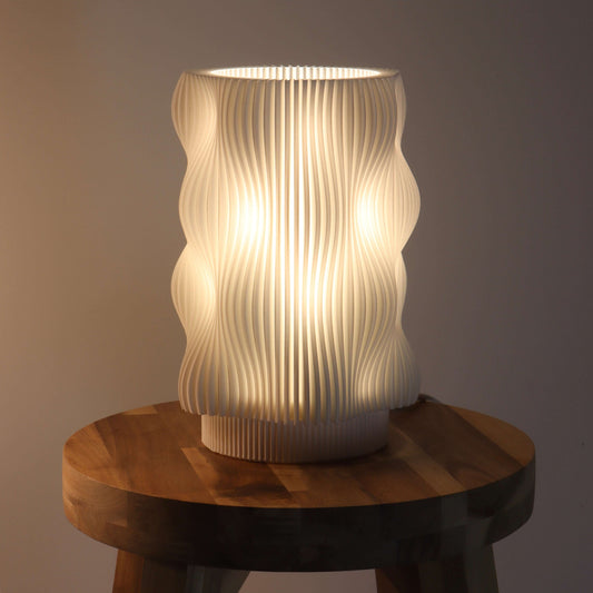 Modern Bubble Lamp on a wooden table illuminating a cozy space with its warm glow, perfect for mood lighting and funky decor.