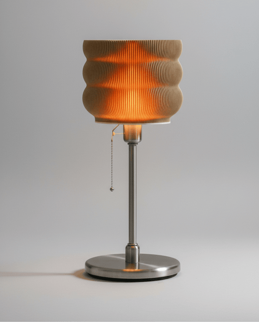 Table lamp with ribbed glass shade on a gray background