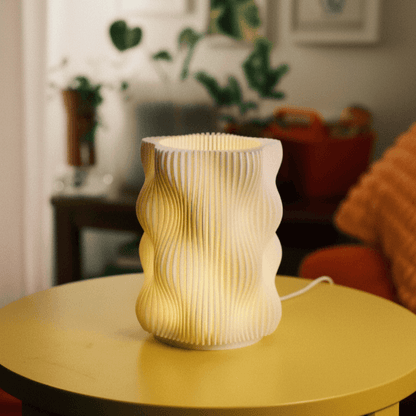 Decorative lamp on a round table with a blurred indoor background