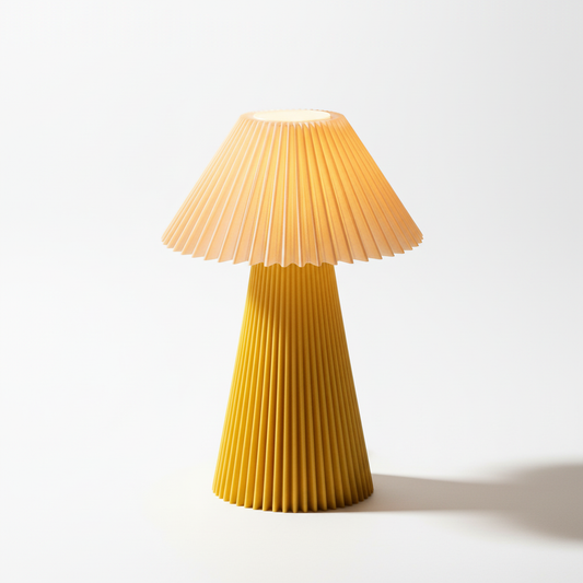 Yellow pleated table lamp on a white background
